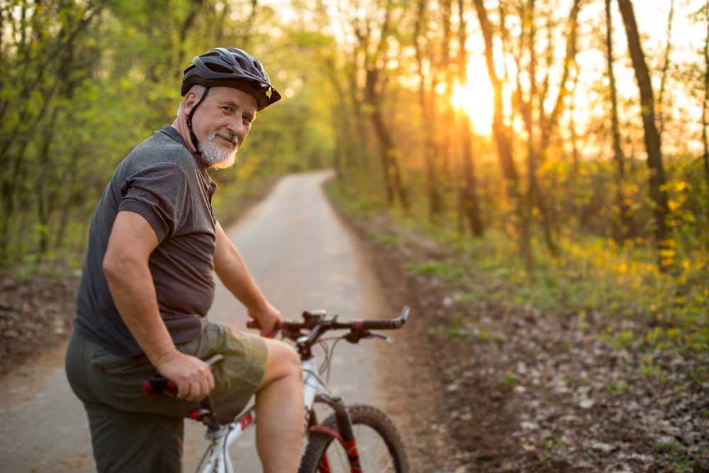 Senior man on his mountain bike outdoors